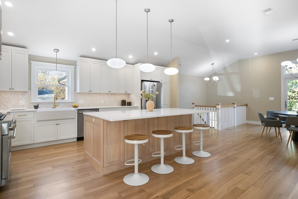 2 Howard Court Woburn, MA 01801 - Photo 7 of 37 a large kitchen with a table and chairs