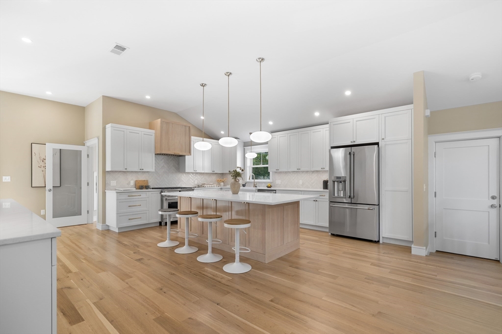 2 Howard Court Woburn, MA 01801 - Photo 10 of 37 a large kitchen with a table and chairs