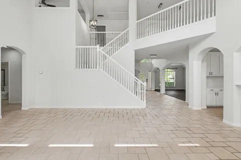a view of entryway and hall with a front door
