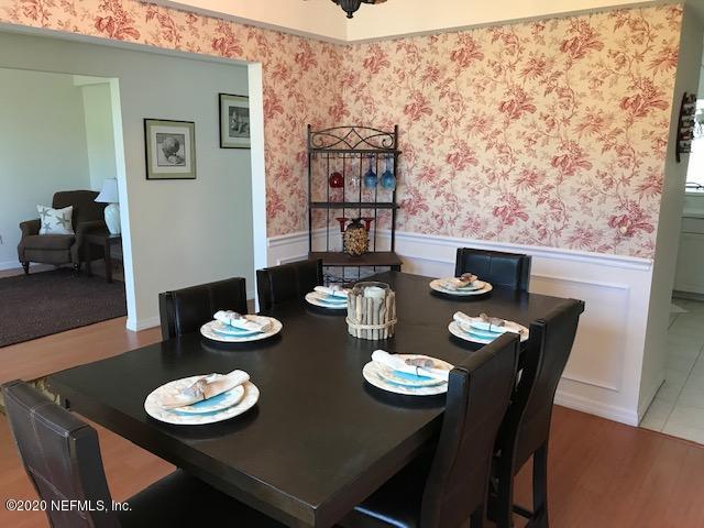 301 Twenty Second Street St. Augustine, FL 32084 - Photo 14 of 25 a view of a dining room with furniture and wooden floor