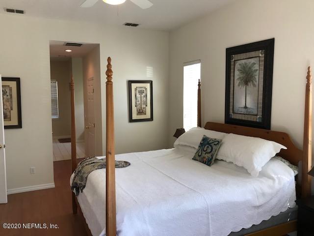 301 Twenty Second Street St. Augustine, FL 32084 - Photo 15 of 25 a bedroom with a bed and a painting