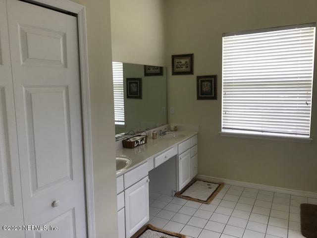 301 Twenty Second Street St. Augustine, FL 32084 - Photo 16 of 25 a bathroom with a sink toilet and mirror