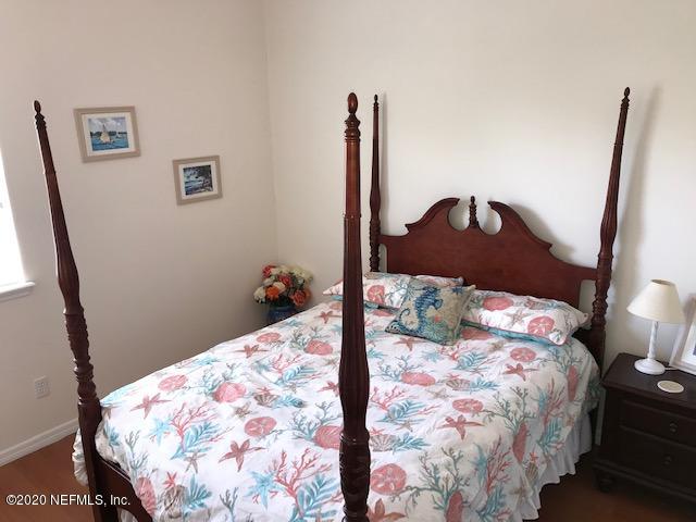 301 Twenty Second Street St. Augustine, FL 32084 - Photo 19 of 25 a bedroom with a bed and a mirror
