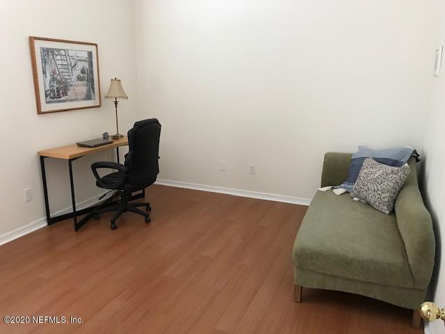 301 Twenty Second Street St. Augustine, FL 32084 - Photo 20 of 25 a bedroom with a bed and a desk