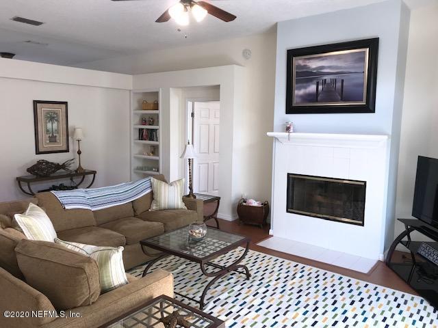 301 Twenty Second Street St. Augustine, FL 32084 - Photo 6 of 25 a living room with furniture and a fireplace