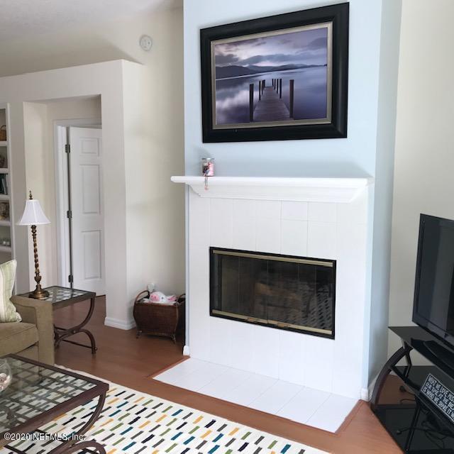301 Twenty Second Street St. Augustine, FL 32084 - Photo 7 of 25 a living room with furniture and a fireplace