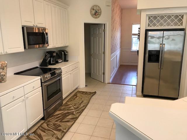 301 Twenty Second Street St. Augustine, FL 32084 - Photo 10 of 25 a kitchen with stainless steel appliances a refrigerator a stove a microwave and cabinets