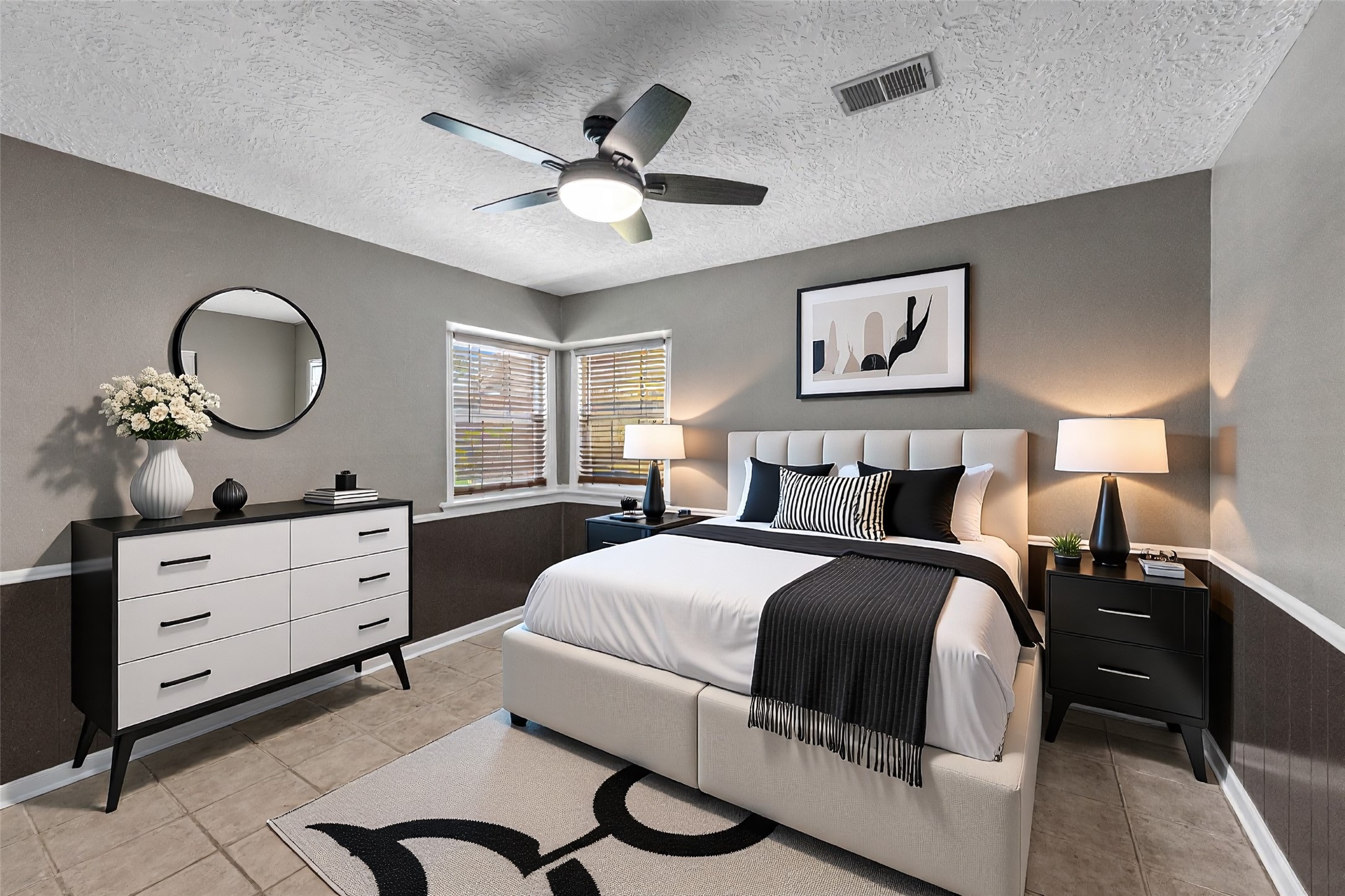 622 South Rivershire Drive Conroe, TX 77304 - Photo 30 of 44 a bedroom with a large bed and a chandelier