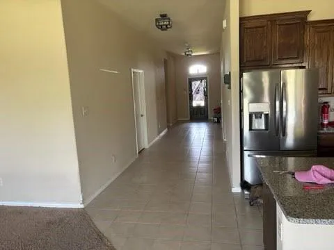 a view of a livingroom with a fireplace and a chandelier