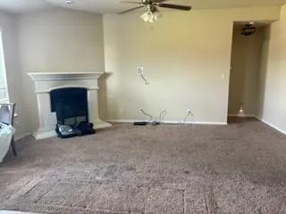 a view of a livingroom with furniture and windows