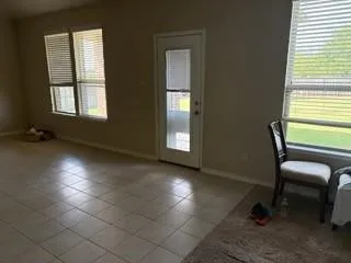 a kitchen with stainless steel appliances granite countertop a refrigerator and a stove