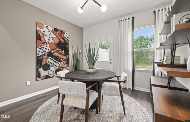 a spacious bedroom with a bed and a large window