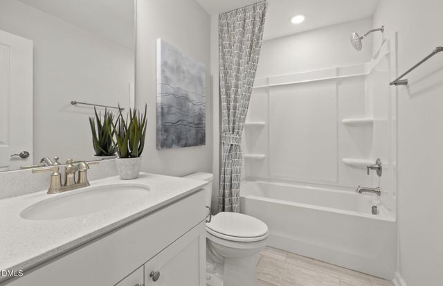 a view of a livingroom with furniture and a window