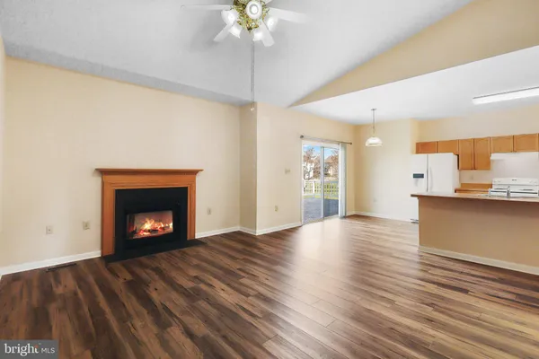a view of an empty room and fire place