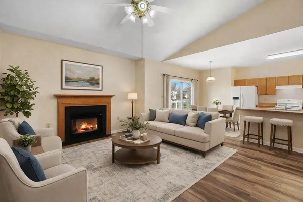 a living room with furniture and a fireplace