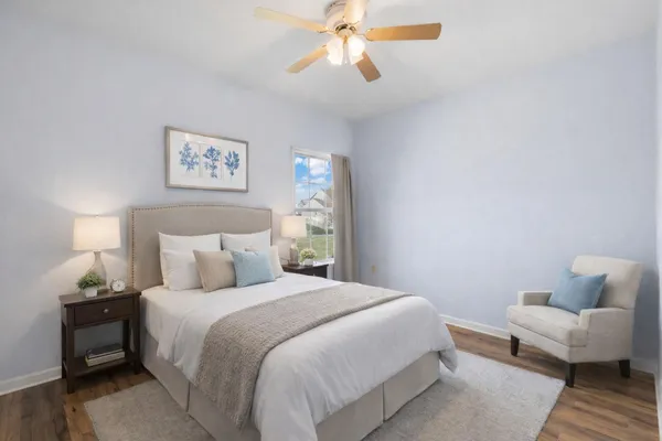 a bedroom with bed and a couch