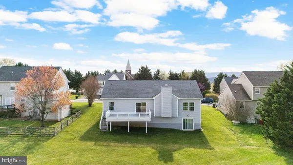 a aerial view of a house with swimming pool and sitting area