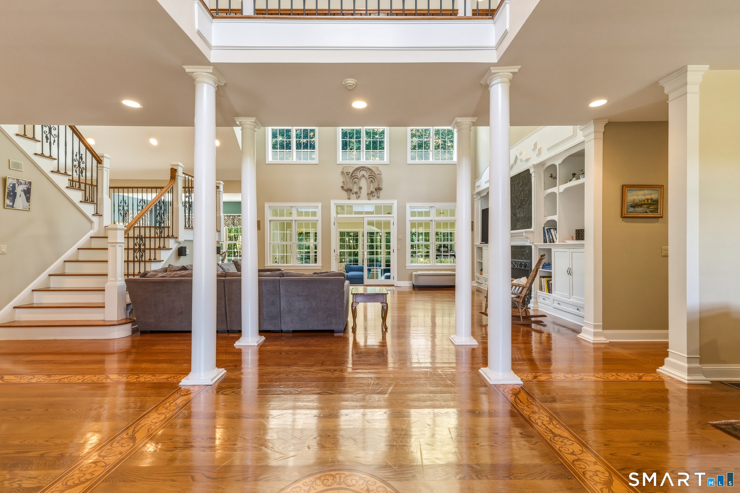 122 Lower Road Guilford, CT 06437 - Photo 7 of 40 Not your average cookie-cutter, this home features distinctive architectural details throughout, including transom windows, elegant columns, thick crown molding, and beautifully crafted millwork that add character and timeless appeal.