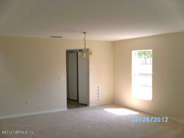 87242 Lents Road Yulee, FL 32097 - Photo 3 of 6 a view of empty room with window