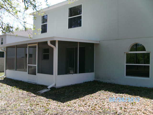 87242 Lents Road Yulee, FL 32097 - Photo 5 of 6 a view of a house with a yard