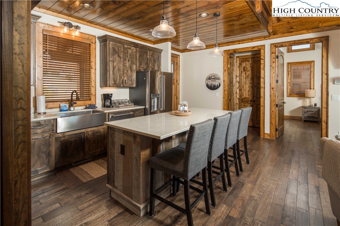 44 Camp Eagle Loop Banner Elk, NC 28604 - Photo 11 of 43 a kitchen with a table chairs and wooden floor