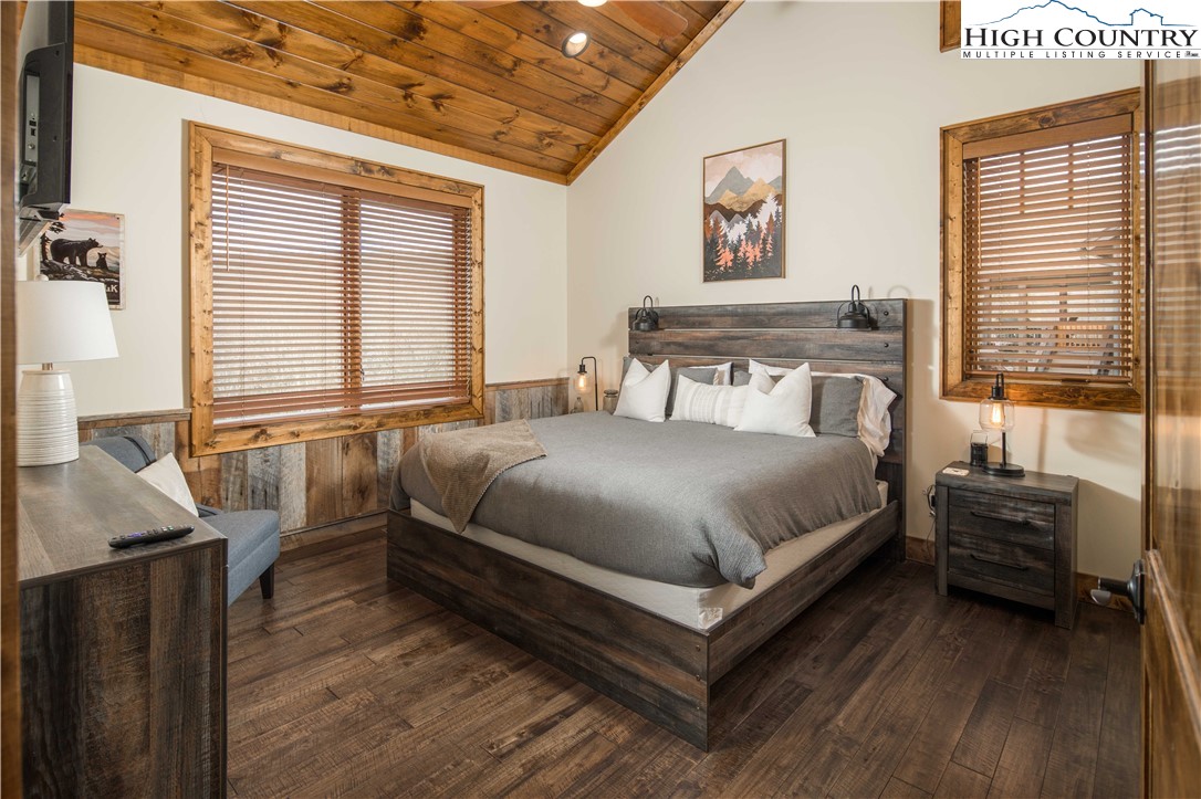 44 Camp Eagle Loop Banner Elk, NC 28604 - Photo 14 of 43 a bedroom with a bed and wooden floor