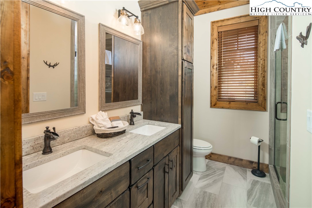 44 Camp Eagle Loop Banner Elk, NC 28604 - Photo 16 of 43 a bathroom with a sink and a mirror