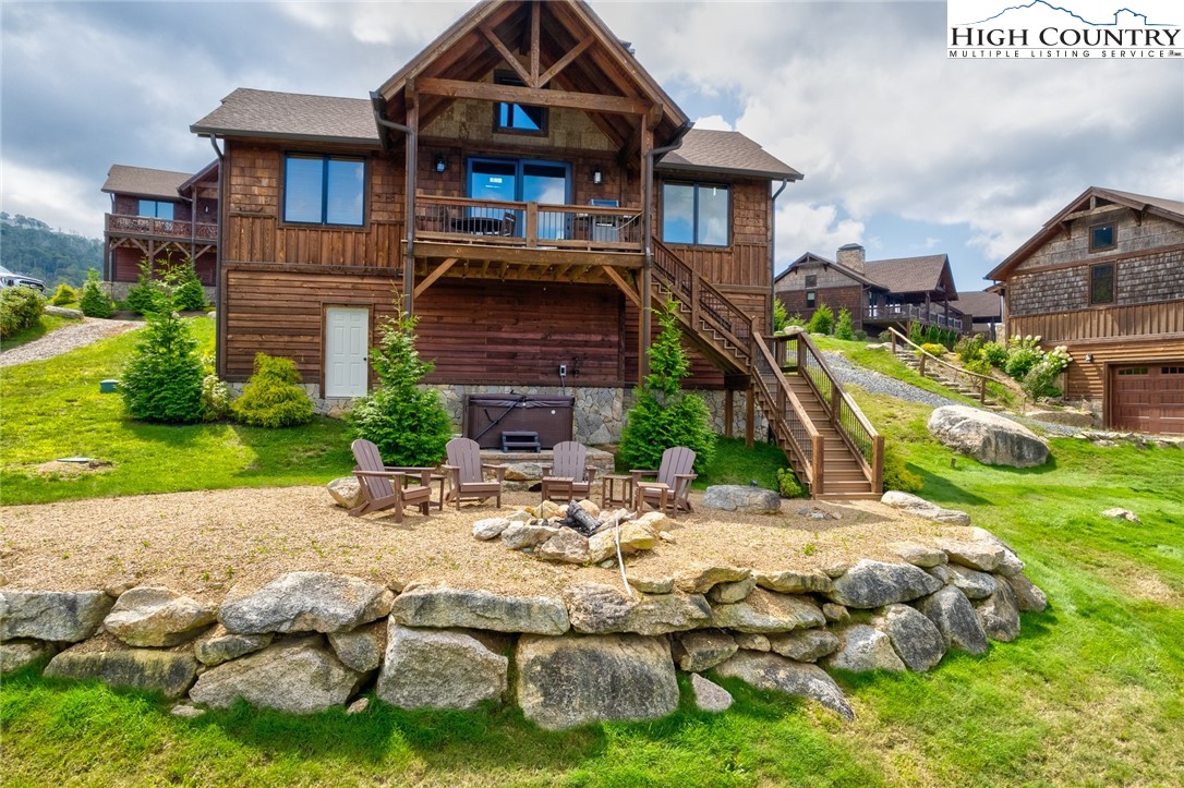 44 Camp Eagle Loop Banner Elk, NC 28604 - Photo 21 of 43 a front view of a house with garden