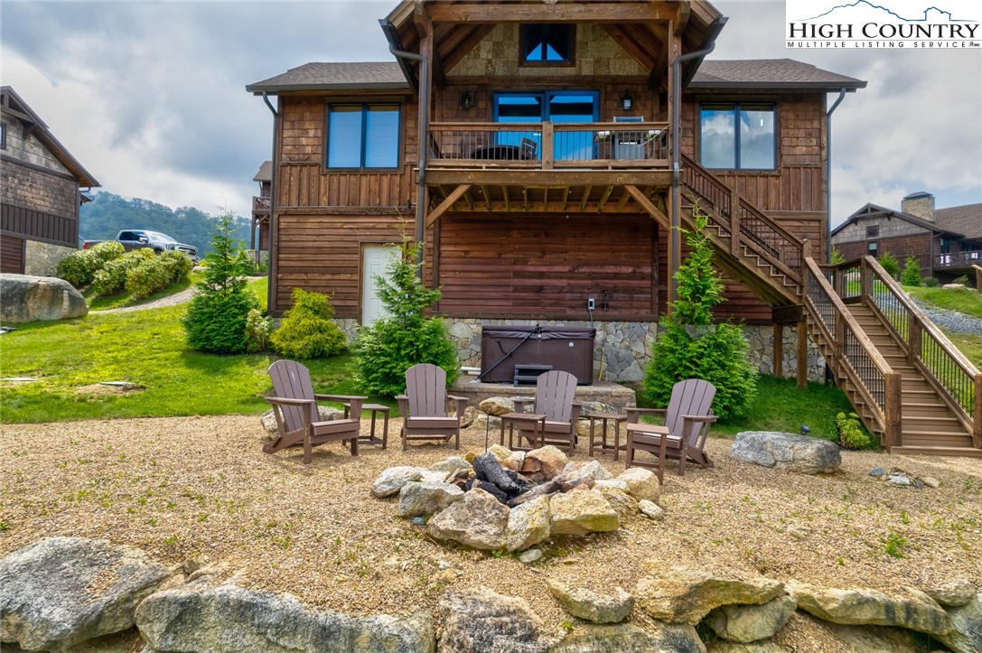44 Camp Eagle Loop Banner Elk, NC 28604 - Photo 22 of 43 a view of a chairs and table in backyard