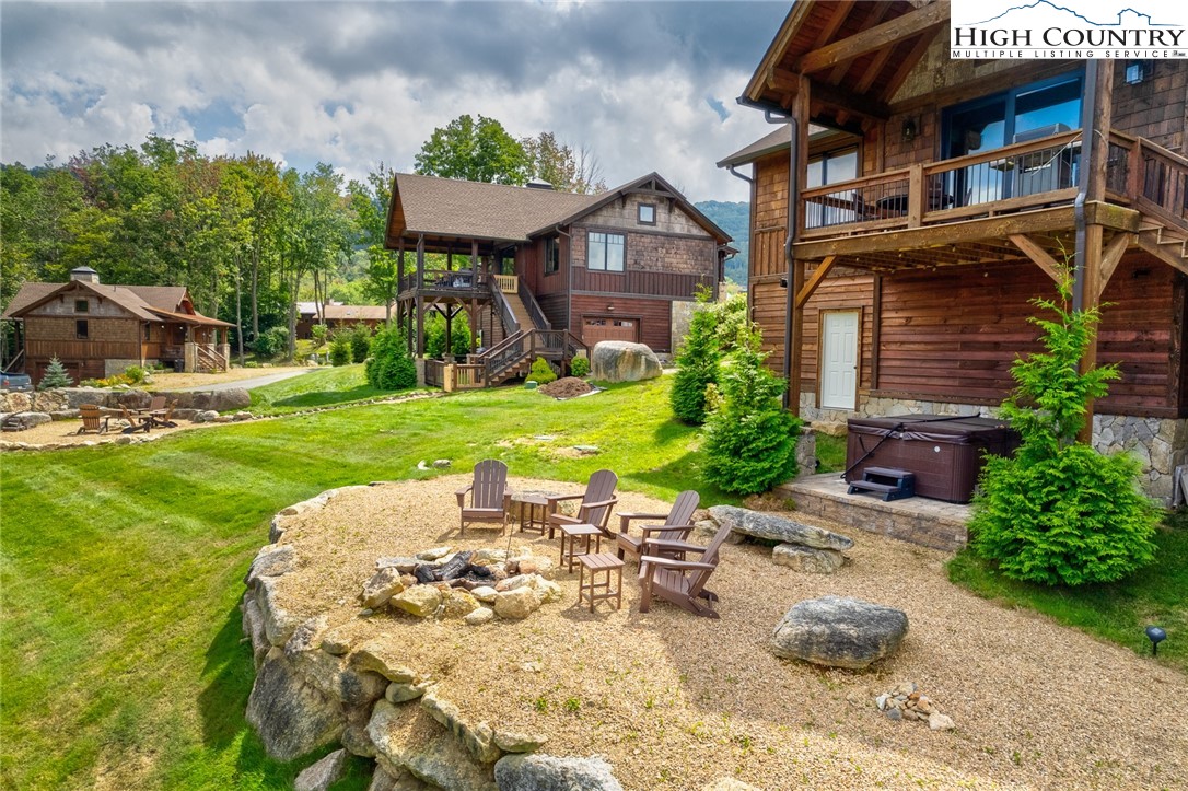 44 Camp Eagle Loop Banner Elk, NC 28604 - Photo 23 of 43 a view of a chairs and table in backyard