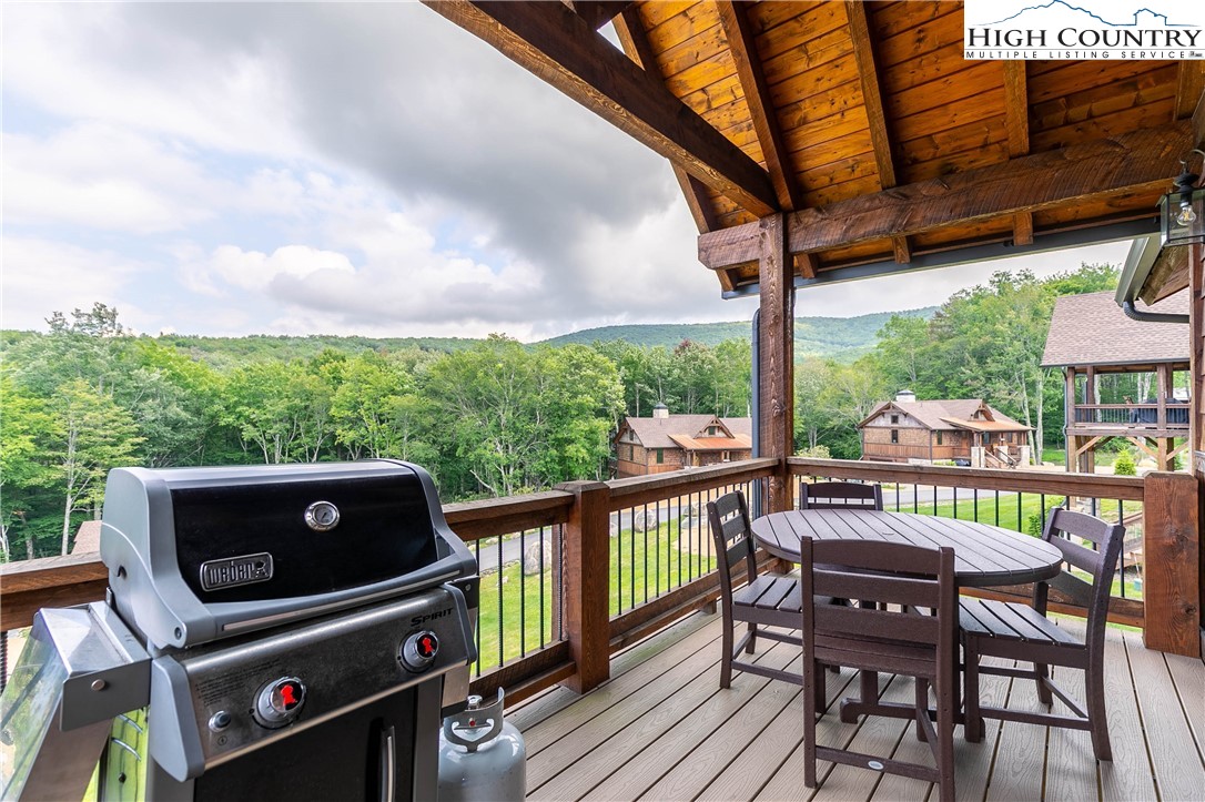 44 Camp Eagle Loop Banner Elk, NC 28604 - Photo 28 of 43 a view of a balcony with chairs and wooden floor