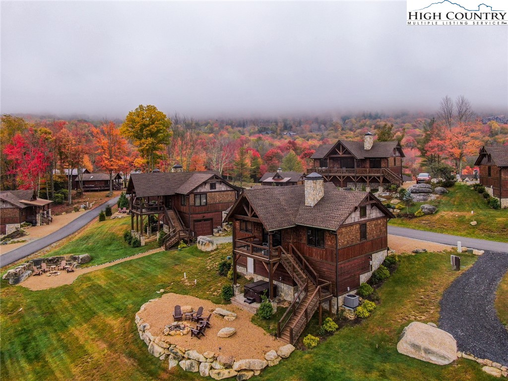 44 Camp Eagle Loop Banner Elk, NC 28604 - Photo 29 of 43 an aerial view of a house with yard swimming pool and outdoor seating
