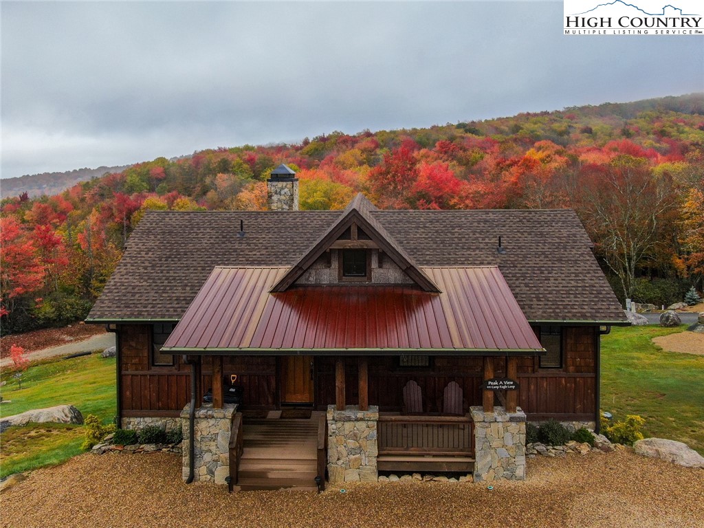 44 Camp Eagle Loop Banner Elk, NC 28604 - Photo 30 of 43 a view of a patio with table and chairs with wooden floor and fence