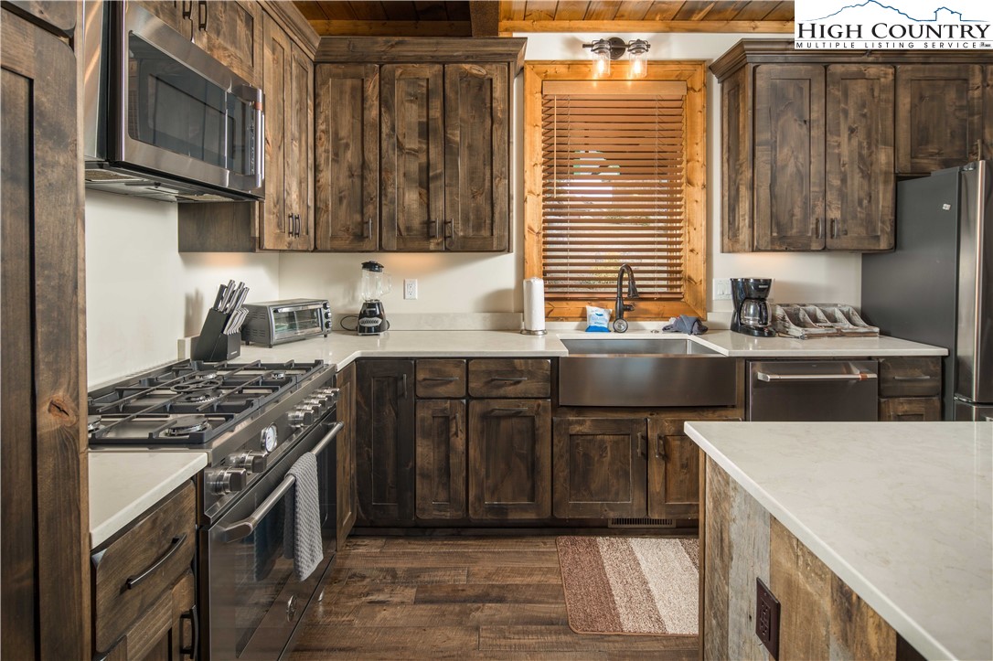 44 Camp Eagle Loop Banner Elk, NC 28604 - Photo 5 of 43 a kitchen with stainless steel appliances a stove a sink and a microwave