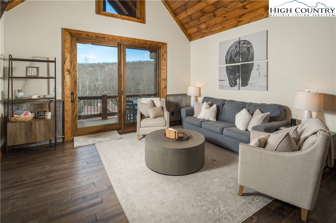 44 Camp Eagle Loop Banner Elk, NC 28604 - Photo 10 of 43 a living room with furniture and a floor to ceiling window