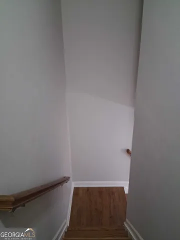 a white toilet and tub sitting next to a bathroom sink