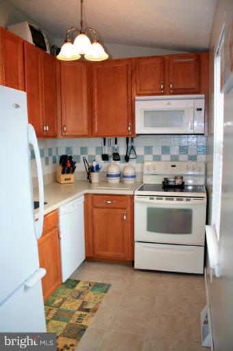 73 Haverhill Road Joppa, MD 21085 - Photo 14 of 30 a kitchen with a sink stove and cabinets
