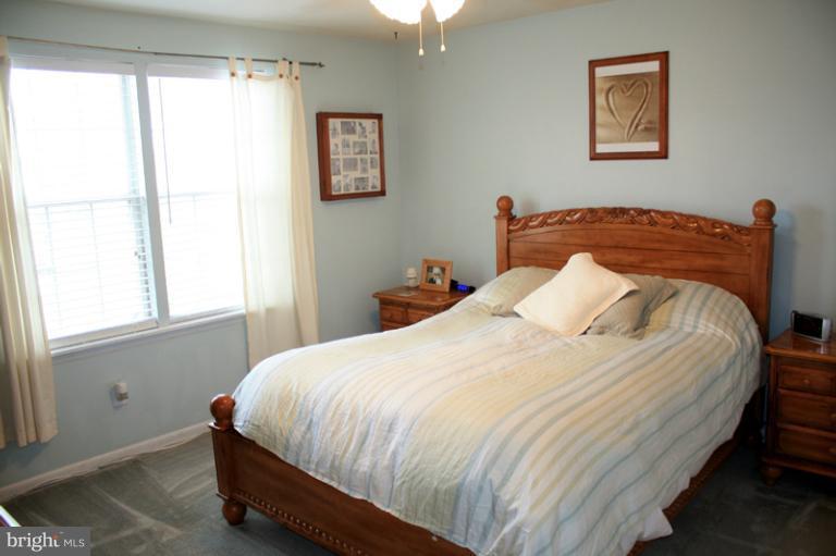 73 Haverhill Road Joppa, MD 21085 - Photo 17 of 30 a bed sitting in a bedroom next to a window