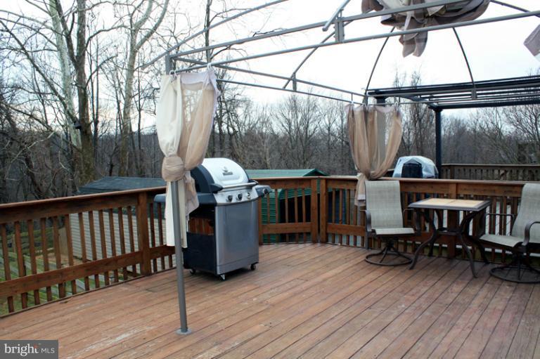 73 Haverhill Road Joppa, MD 21085 - Photo 23 of 30 a view of a balcony with chairs and wooden floor