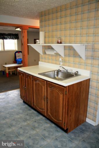 73 Haverhill Road Joppa, MD 21085 - Photo 5 of 30 a kitchen with a sink and a stove