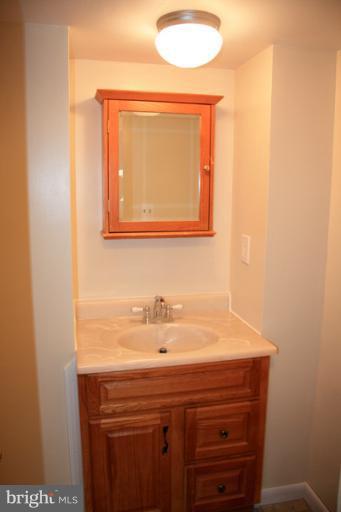 73 Haverhill Road Joppa, MD 21085 - Photo 6 of 30 a bathroom with a sink and a mirror