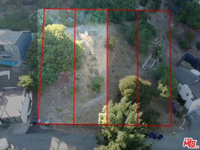 a backyard of a house with a yard and outdoor seating