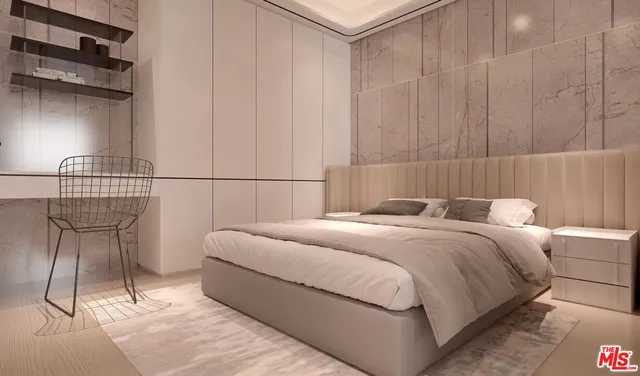 a bedroom with a bed a chair and potted plant on the dresser