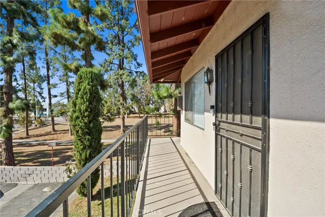a view of a balcony with wooden floor and stairs