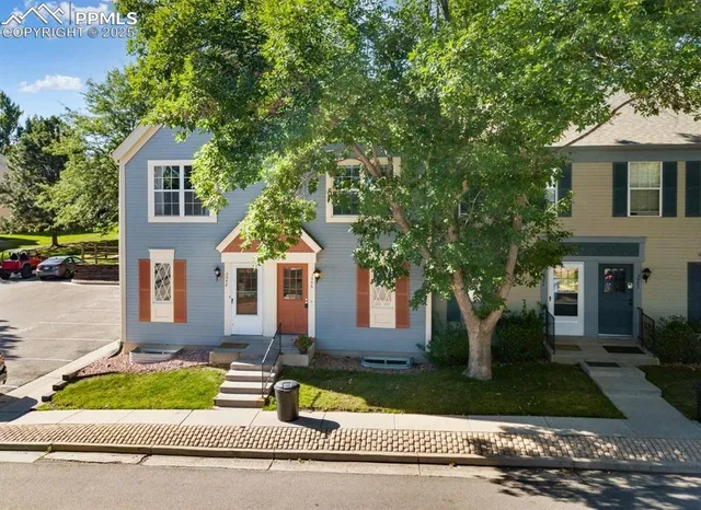 front view of a house with a yard