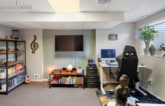 a bedroom with furniture and a flat screen tv