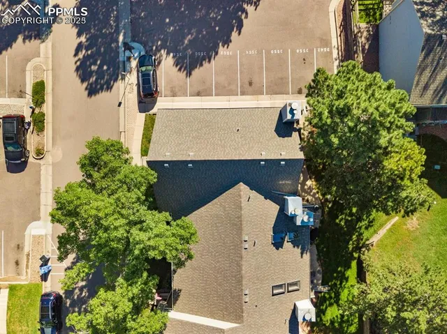 an aerial view of a house with a garden