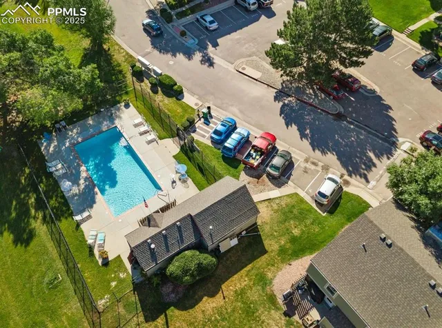 an aerial view of a house with a swimming pool