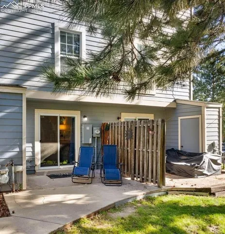 a view of a house with backyard porch and furniture