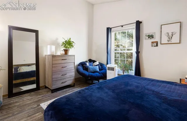 a bedroom with a bed and dresser